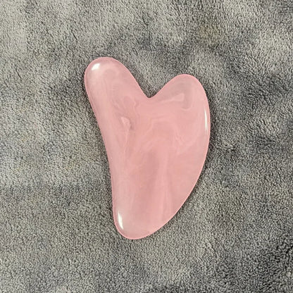 Gua-Sha-facial-stone-cire-d'abeille-massage-visage-cernes-relaxation-rose