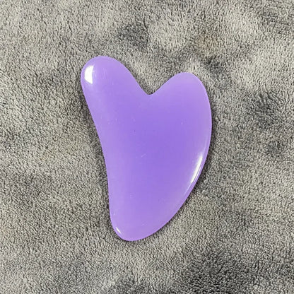 Gua-Sha-facial-stone-cire-d'abeille-massage-visage-cernes-relaxation-mauve